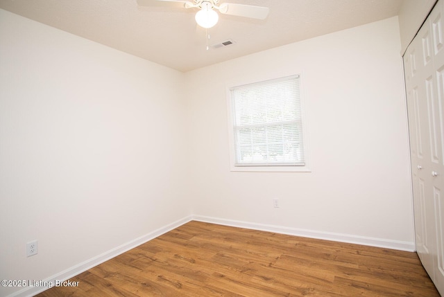 3833 Jupiter Rd, Louisville, KY 40218 - unfurnished bedroom featuring a closet, baseboards, light wood-style floors, and a ceiling fan