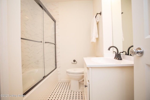 3833 Jupiter Rd, Louisville, KY 40218 - bathroom with vanity, toilet, shower / bath combination with glass door, and tile patterned floors