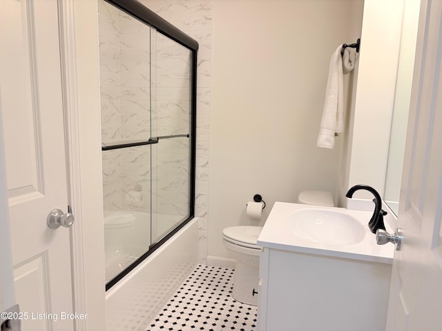 3833 Jupiter Rd, Louisville, KY 40218 - bathroom featuring toilet, vanity, enclosed tub / shower combo, and tile patterned floors