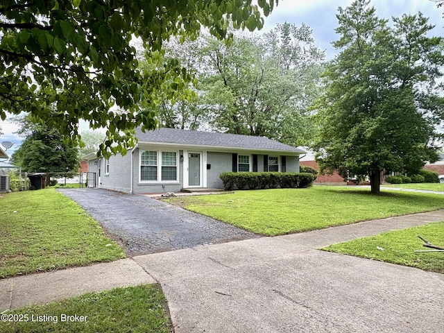 3833 Jupiter Rd, Louisville, KY 40218 - ranch-style home with brick siding, a front yard, and driveway