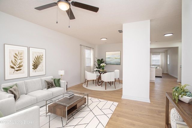 3833 Jupiter Rd, Louisville, KY 40218 - living room with light wood-style flooring, plenty of natural light, baseboards, a ceiling fan, and recessed lighting