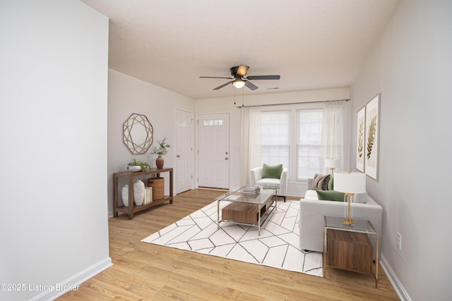 3833 Jupiter Rd, Louisville, KY 40218 - living area featuring wood finished floors, ceiling fan, and baseboards