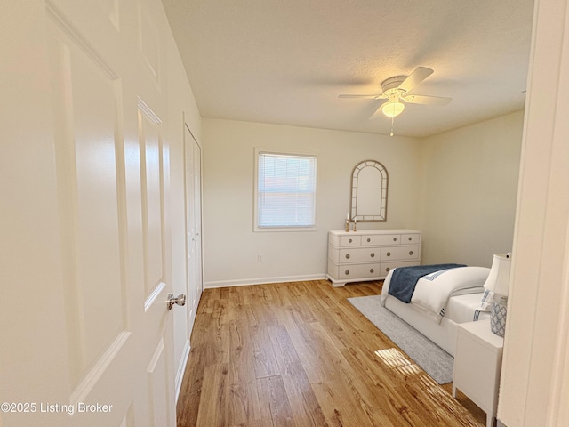 3833 Jupiter Rd, Louisville, KY 40218 - bedroom with light wood-style flooring, baseboards, and a ceiling fan