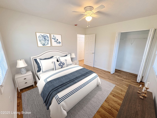 3833 Jupiter Rd, Louisville, KY 40218 - bedroom featuring wood finished floors, baseboards, ceiling fan, and a closet