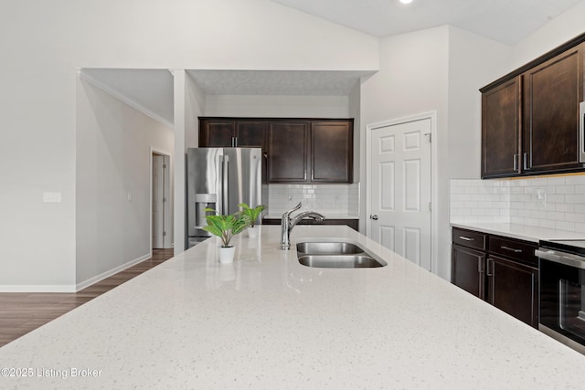 8806 Warbler Branch Way, Louisville, KY 40229 - kitchen with dark brown cabinets, baseboards, light stone countertops, appliances with stainless steel finishes, and a sink