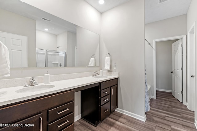 8806 Warbler Branch Way, Louisville, KY 40229 - full bath with double vanity, wood finished floors, and a sink