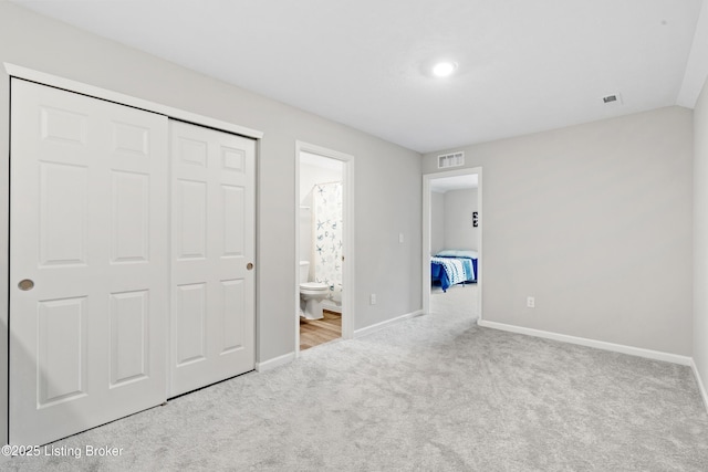 8806 Warbler Branch Way, Louisville, KY 40229 - unfurnished bedroom featuring visible vents, a closet, connected bathroom, carpet flooring, and baseboards