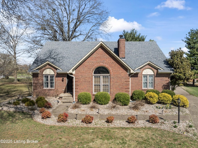 6709 Wild Fox Ln, Prospect, KY 40059 - single story home featuring brick siding, roof with shingles, a front yard, and a chimney