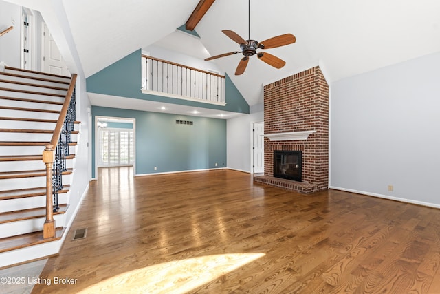 6709 Wild Fox Ln, Prospect, KY 40059 - unfurnished living room with visible vents, high vaulted ceiling, ceiling fan, and stairs