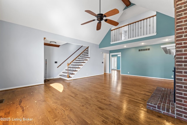6709 Wild Fox Ln, Prospect, KY 40059 - unfurnished living room featuring stairway, wood finished floors, ceiling fan, and a fireplace