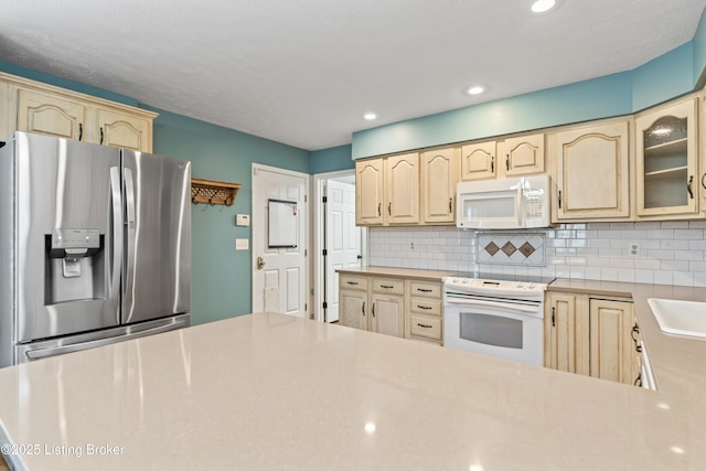 6709 Wild Fox Ln, Prospect, KY 40059 - kitchen with white appliances, glass insert cabinets, light brown cabinets, decorative backsplash, and light countertops