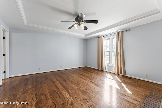 6709 Wild Fox Ln, Prospect, KY 40059 - empty room featuring visible vents, ceiling fan, a tray ceiling, baseboards, and dark wood finished floors