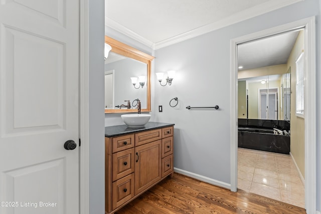 6709 Wild Fox Ln, Prospect, KY 40059 - bathroom with baseboards, wood finished floors, crown molding, and vanity