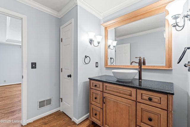6709 Wild Fox Ln, Prospect, KY 40059 - bathroom featuring ornamental molding, vanity, visible vents, and wood finished floors