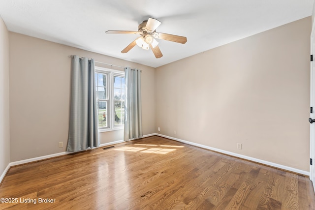 6709 Wild Fox Ln, Prospect, KY 40059 - unfurnished room featuring a ceiling fan, visible vents, wood finished floors, and baseboards