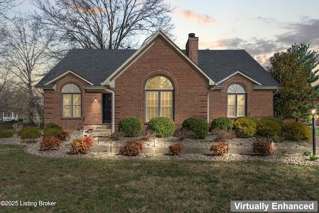 6709 Wild Fox Ln, Prospect, KY 40059 - view of front of property with a front lawn, a chimney, a shingled roof, and brick siding
