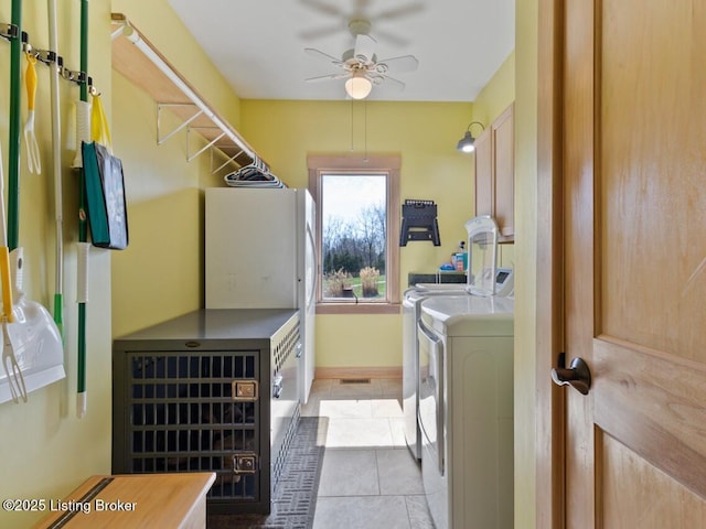 washroom featuring tile patterned floors, laundry area, baseboards, independent washer and dryer, and ceiling fan