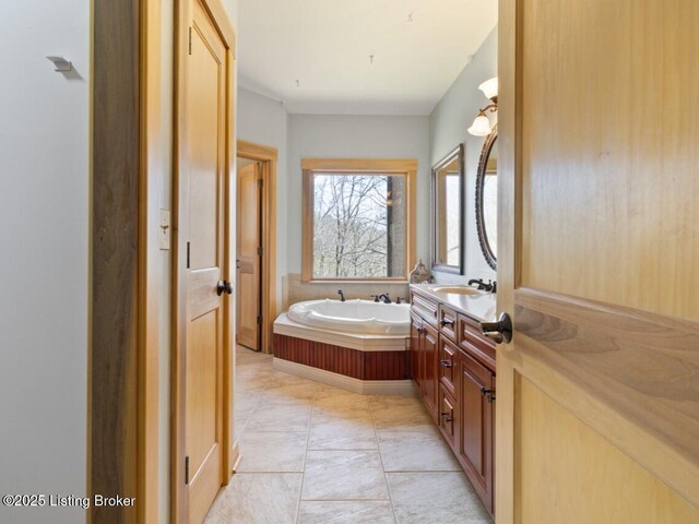 full bath featuring vanity and a bath