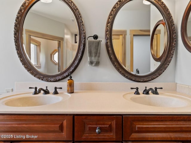 bathroom featuring double vanity and a sink
