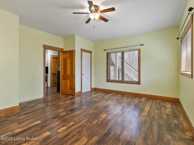 unfurnished bedroom with baseboards, ceiling fan, and wood finished floors