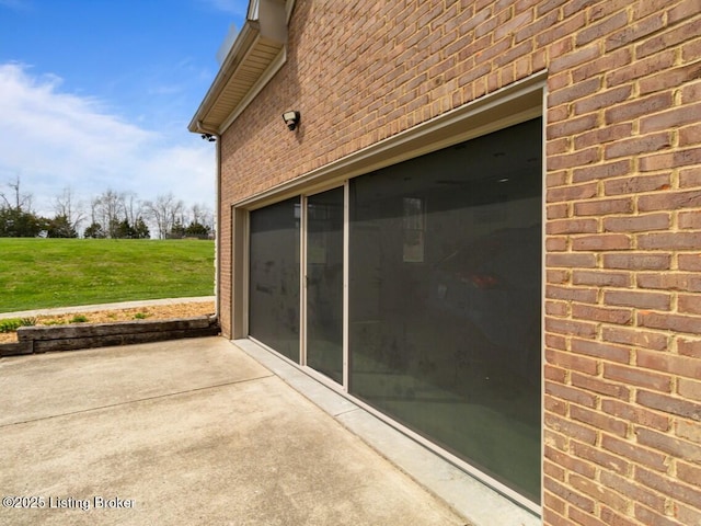 exterior space with brick siding