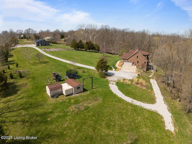 aerial view featuring a rural view and a view of trees