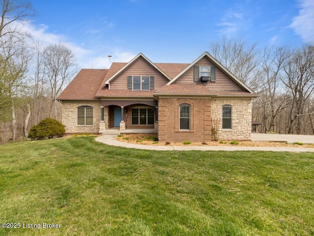 craftsman inspired home with a front lawn, covered porch, stone siding, and roof with shingles
