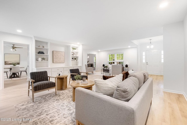 1911 Bainbridge Row Dr, Louisville, KY 40207 - living room with built in shelves, recessed lighting, ceiling fan, and light wood-style flooring