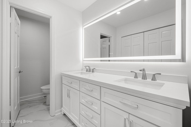 1911 Bainbridge Row Dr, Louisville, KY 40207 - full bathroom featuring baseboards, marble finish floor, toilet, and a sink