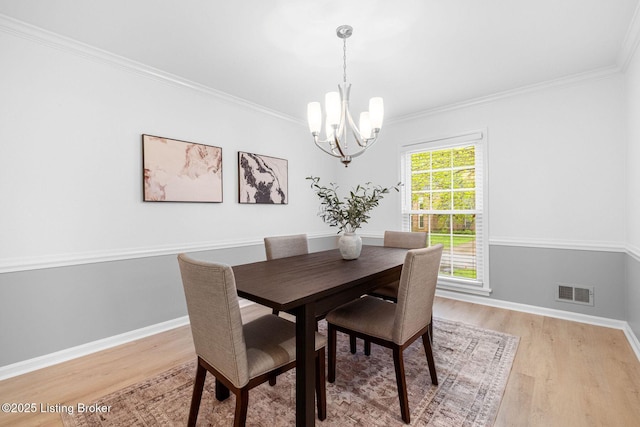 1911 Bainbridge Row Dr, Louisville, KY 40207 - dining area featuring light wood-type flooring, visible vents, a notable chandelier, and crown molding