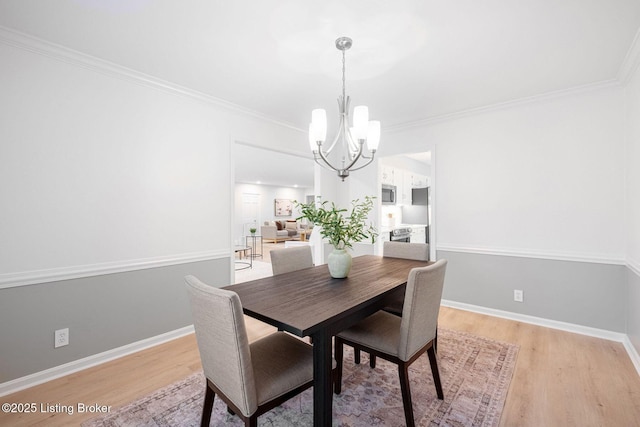 1911 Bainbridge Row Dr, Louisville, KY 40207 - dining space featuring a chandelier, light wood-type flooring, crown molding, and baseboards