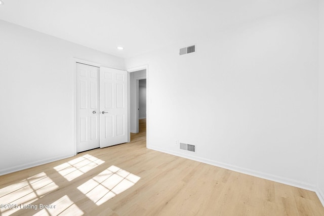 1911 Bainbridge Row Dr, Louisville, KY 40207 - unfurnished bedroom featuring baseboards, visible vents, wood finished floors, and a closet