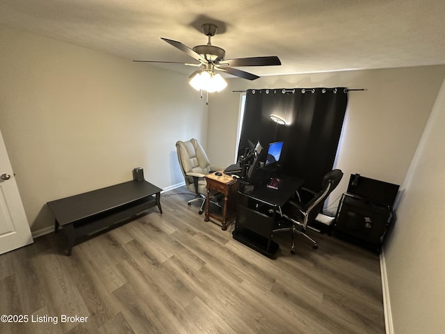 4177 Fairgrounds Rd, Brandenburg, KY 40108 - home office featuring baseboards, a ceiling fan, and wood finished floors