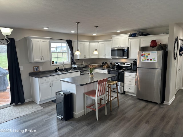 4177 Fairgrounds Rd, Brandenburg, KY 40108 - kitchen featuring white cabinets, stainless steel appliances, dark countertops, and a sink