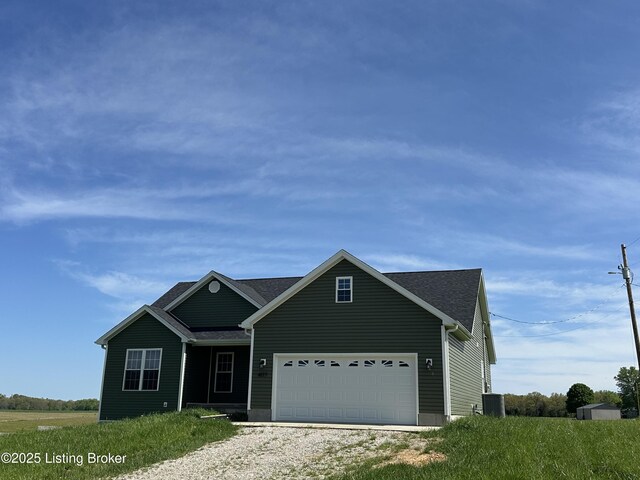 4177 Fairgrounds Rd, Brandenburg, KY 40108 - view of front of property with an attached garage, central air condition unit, and driveway