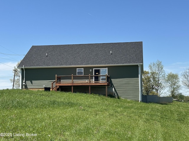 4177 Fairgrounds Rd, Brandenburg, KY 40108 - rear view of property featuring roof with shingles, a wooden deck, and a yard