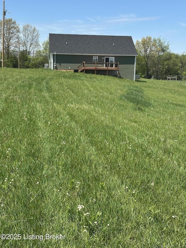4177 Fairgrounds Rd, Brandenburg, KY 40108 - rear view of property featuring a lawn and a deck