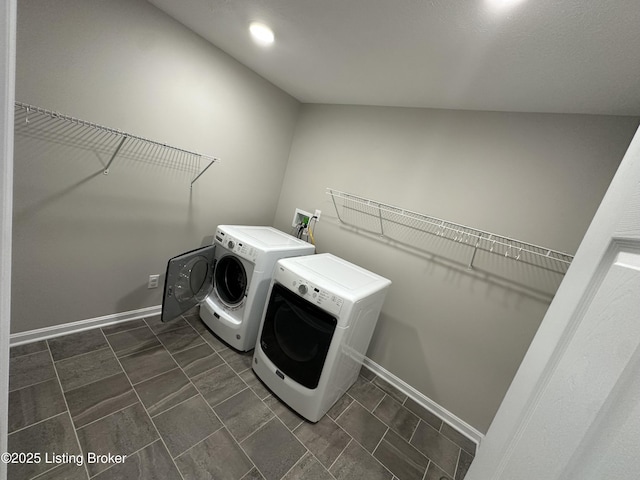 4177 Fairgrounds Rd, Brandenburg, KY 40108 - clothes washing area featuring washing machine and clothes dryer, laundry area, and baseboards