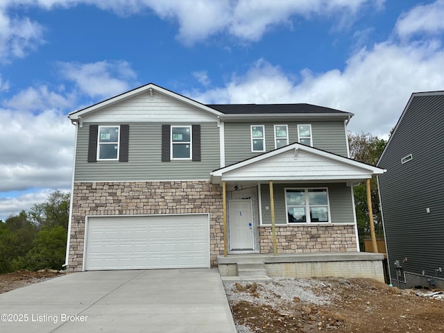 1004 Dry Run Ct, Shelbyville, KY 40065 - view of front of house featuring concrete driveway, stone siding, covered porch, and a garage