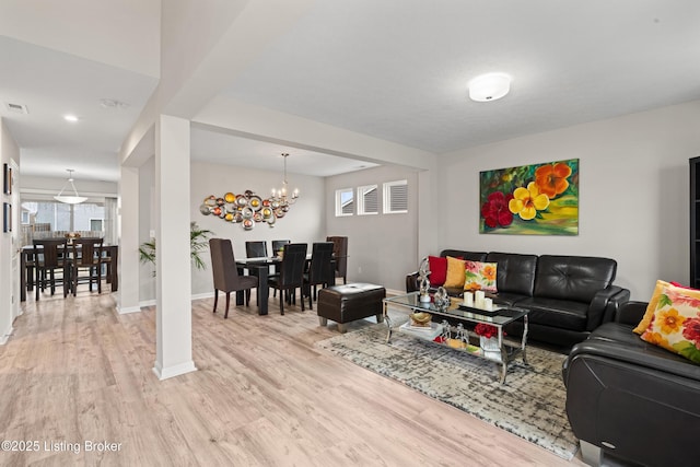 115 Shadow Rock Ct, Shepherdsville, KY 40165 - living area featuring an inviting chandelier, baseboards, and light wood-type flooring