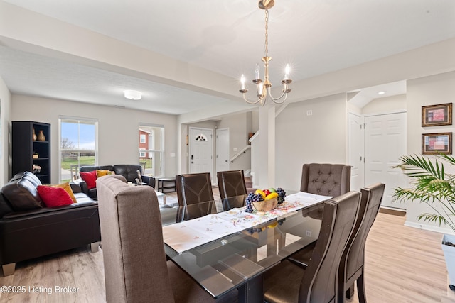 115 Shadow Rock Ct, Shepherdsville, KY 40165 - dining area with a chandelier, light wood-type flooring, and baseboards