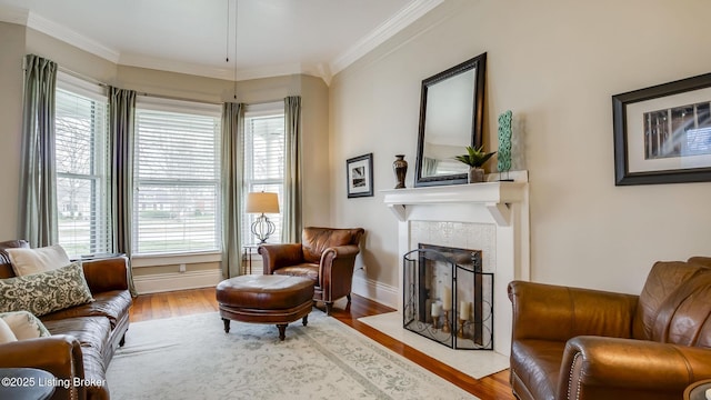 4742 Southern Pkwy, Louisville, KY 40214 - living room featuring a fireplace with flush hearth, baseboards, wood finished floors, and crown molding