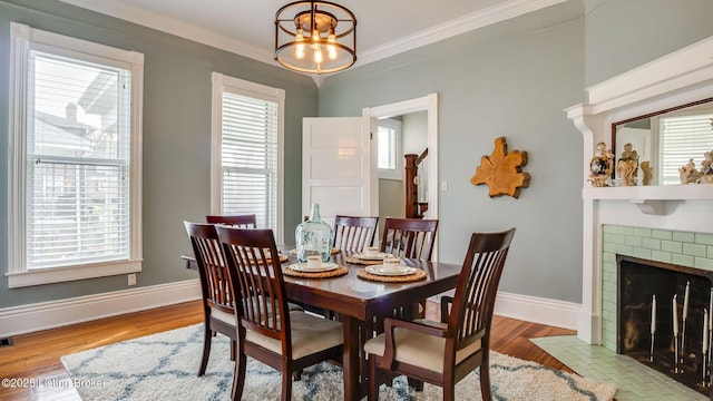 4742 Southern Pkwy, Louisville, KY 40214 - dining room with a notable chandelier, crown molding, baseboards, and wood finished floors