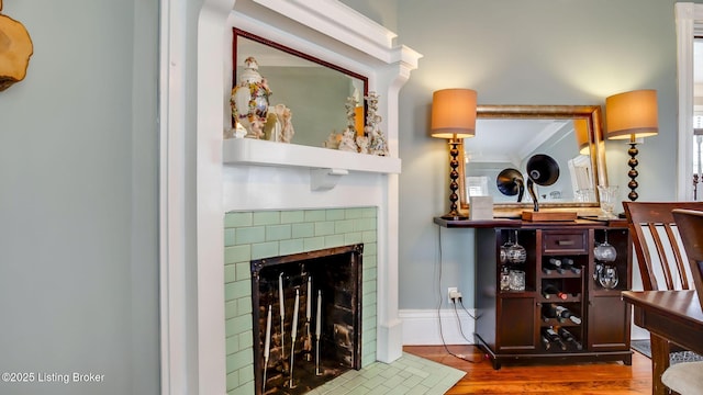 4742 Southern Pkwy, Louisville, KY 40214 - living room with baseboards, wood finished floors, and a tile fireplace