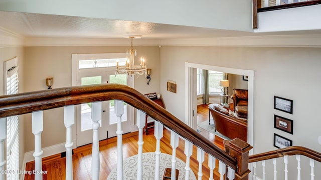 4742 Southern Pkwy, Louisville, KY 40214 - staircase with an inviting chandelier, ornamental molding, and wood finished floors