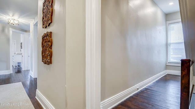 4742 Southern Pkwy, Louisville, KY 40214 - hallway with baseboards, dark wood-style flooring, and plenty of natural light
