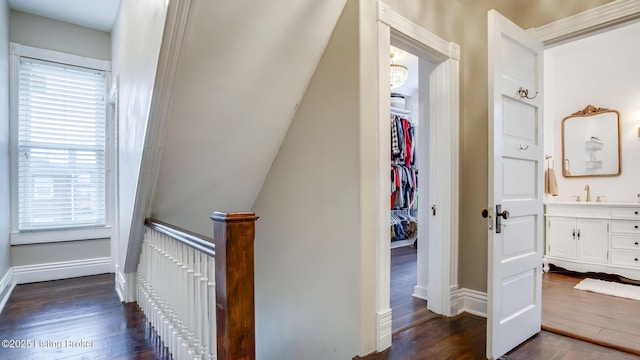 4742 Southern Pkwy, Louisville, KY 40214 - hallway featuring baseboards, a sink, and dark wood finished floors