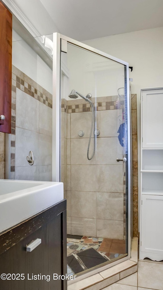 4742 Southern Pkwy, Louisville, KY 40214 - bathroom with tile patterned flooring, a stall shower, and tile walls