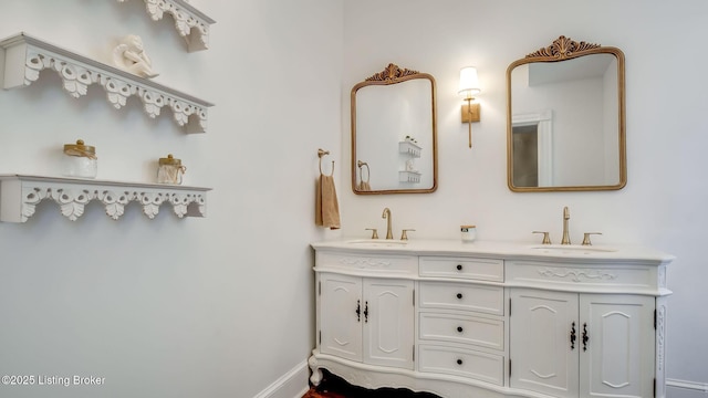 4742 Southern Pkwy, Louisville, KY 40214 - full bathroom featuring double vanity, baseboards, and a sink