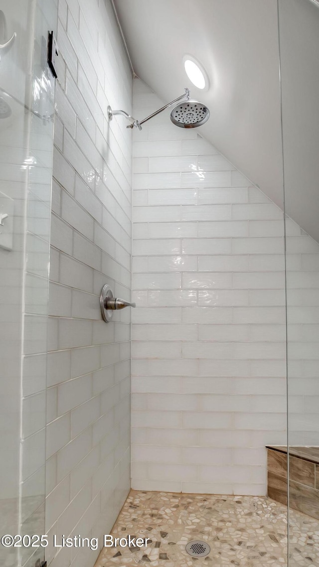 4742 Southern Pkwy, Louisville, KY 40214 - bathroom featuring vaulted ceiling and a tile shower
